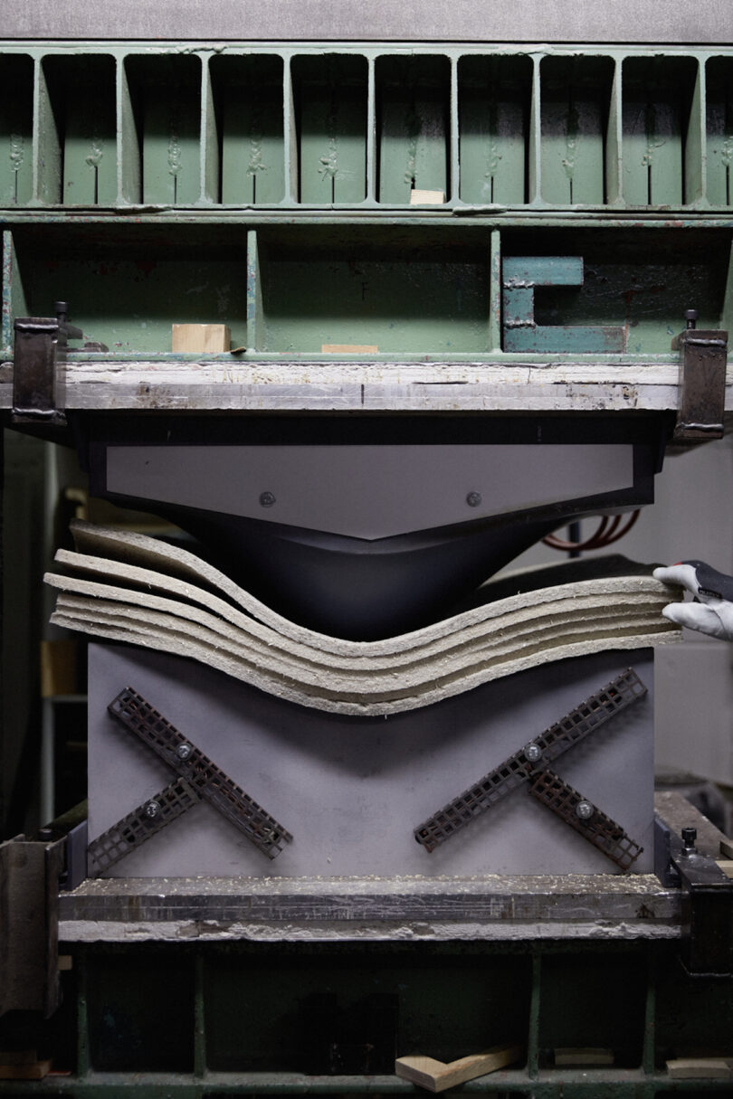 shell chair being pressed into shape