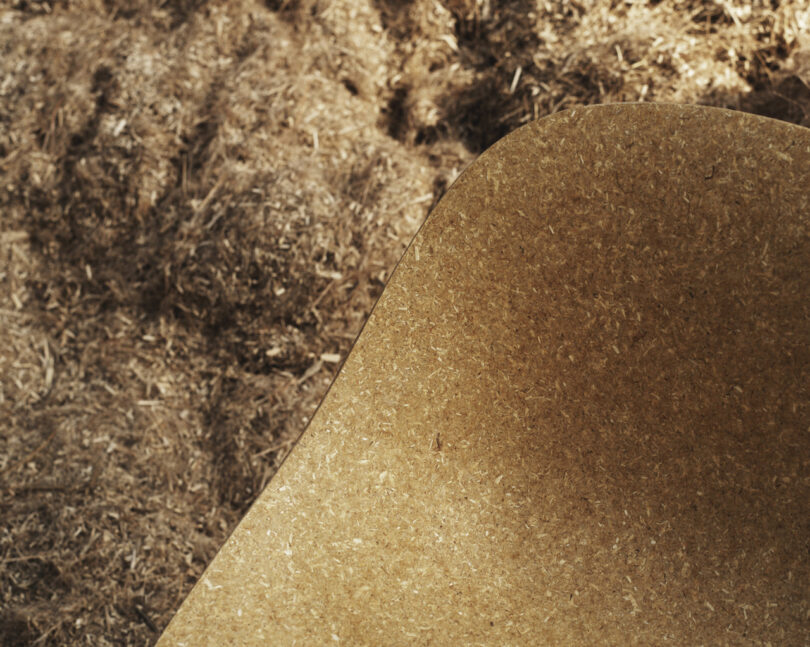 chair in front of a large pile of hemp fibers