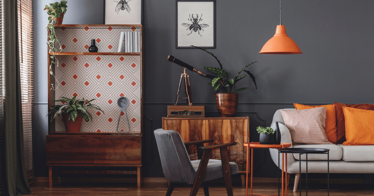 A grey living room with hints of orange.