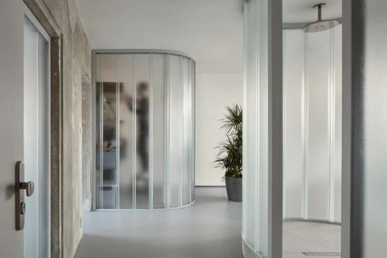 Sculptor Apartment in Prague With Curved Translucent Glass Walls