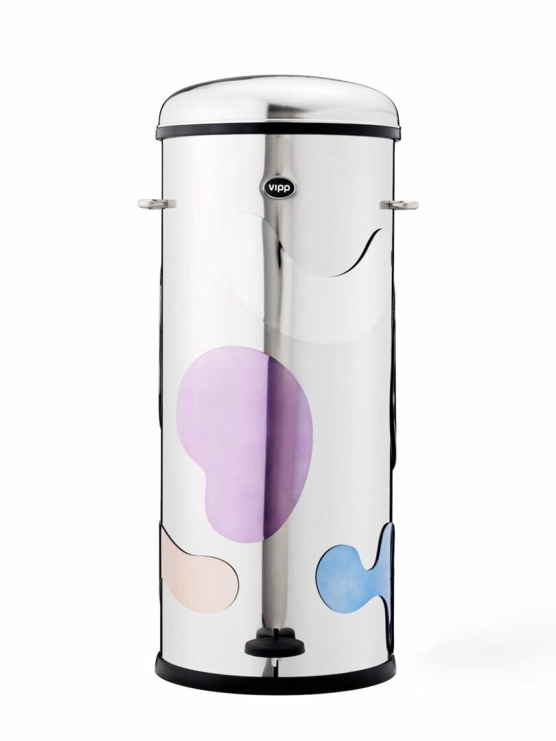 tall cylindrical steel trash can with various magnetic shapes attached to it