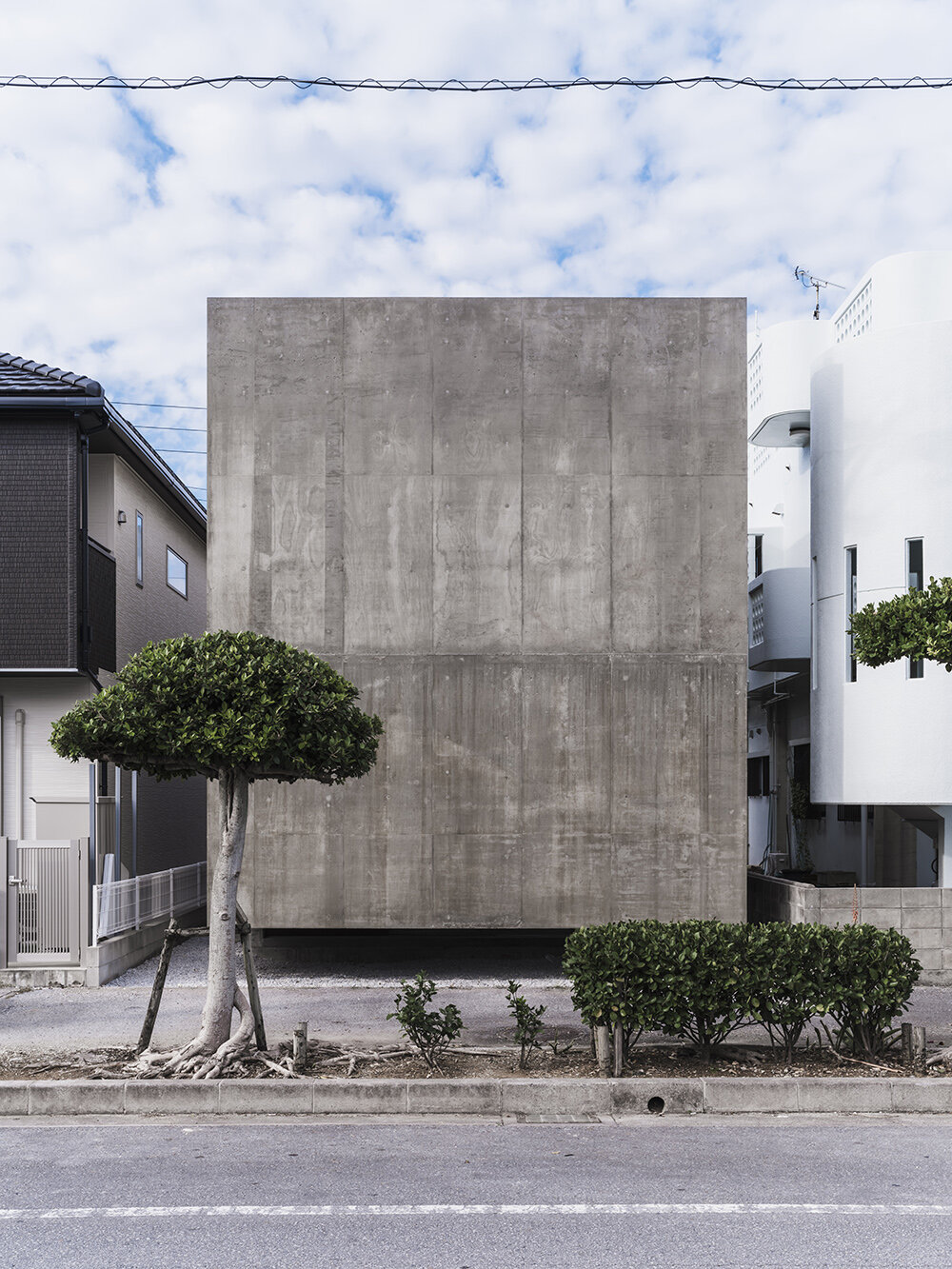 studio cochi architects' house in nishizaki stands as a windowless concrete block in okinawa