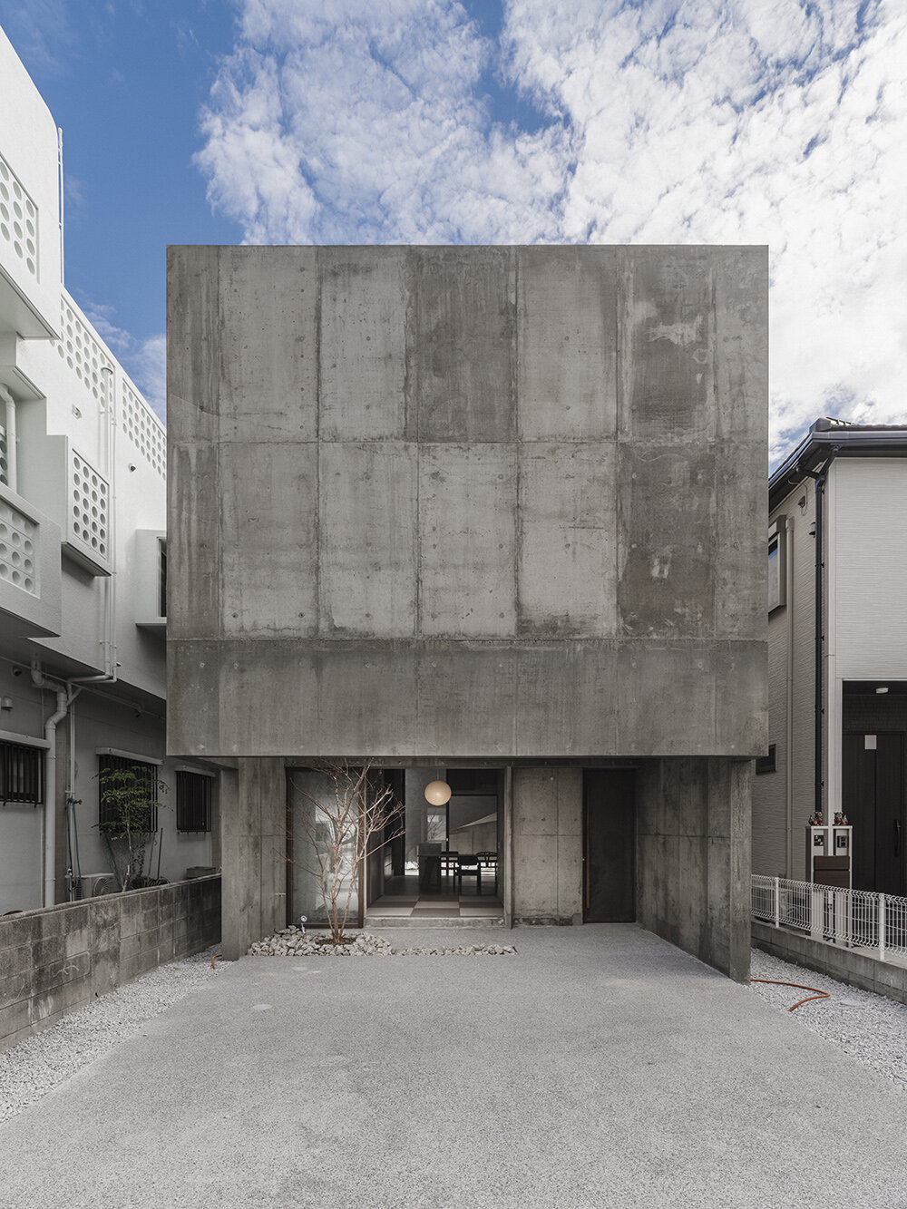 studio cochi architects' house in nishizaki stands as a windowless concrete block in okinawa