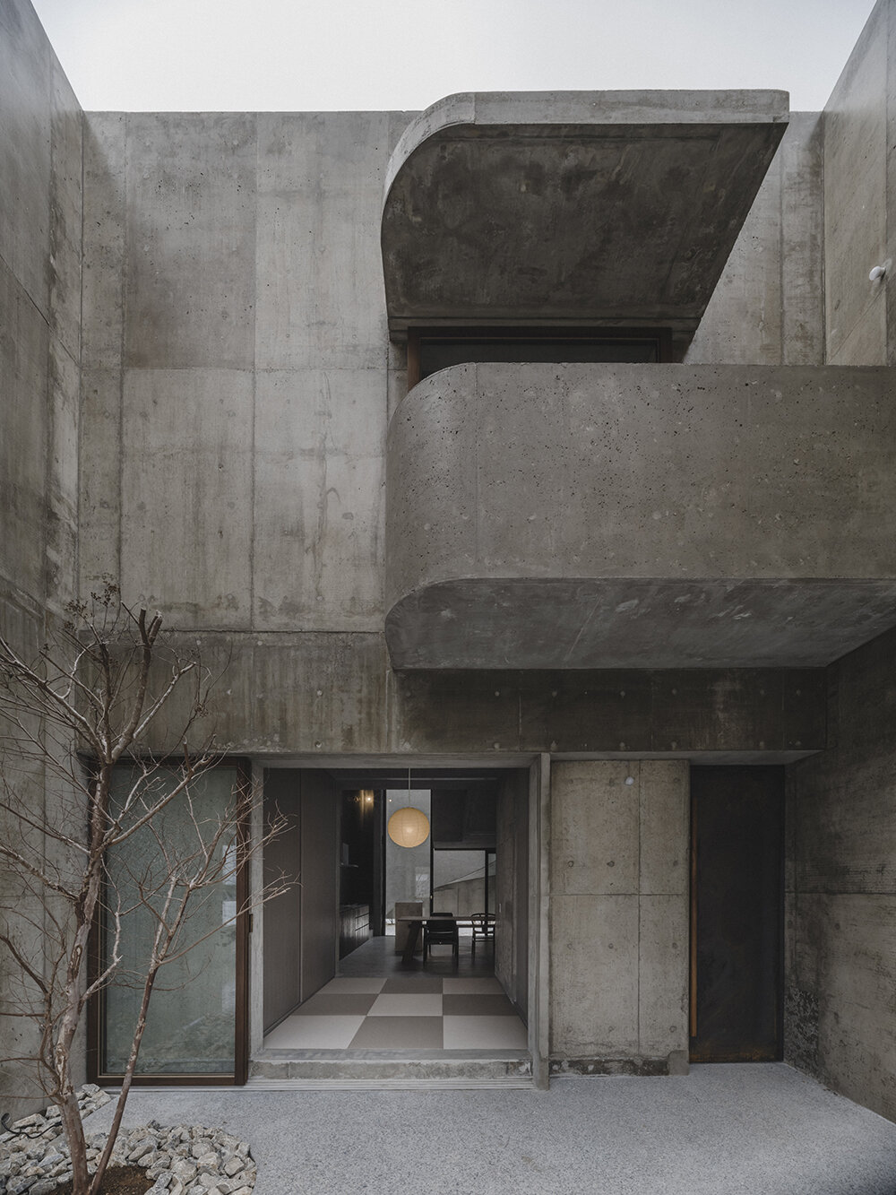 studio cochi architects' house in nishizaki stands as a windowless concrete block in okinawa