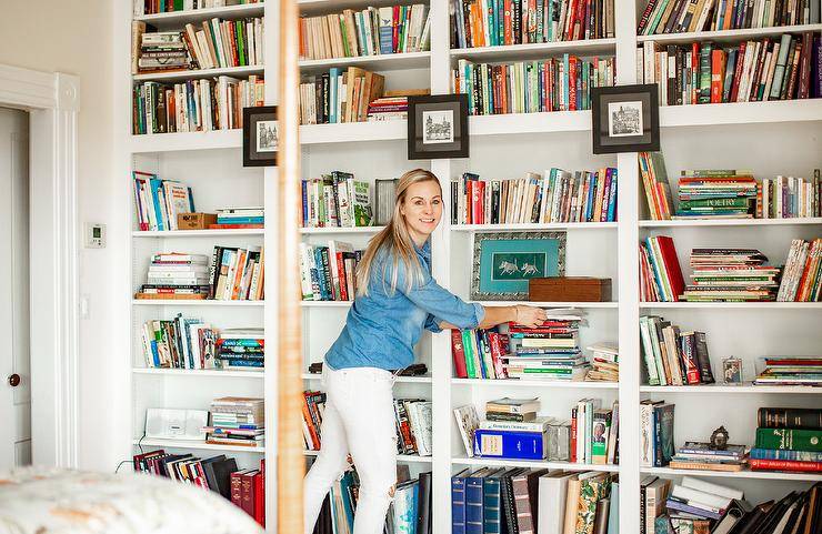 This home library located in the master bedroom of true farmhouse extends from the floor to the ceiling. Custom built to hold all of the owners personal books. The bright white really makes the books pop off the shelf.