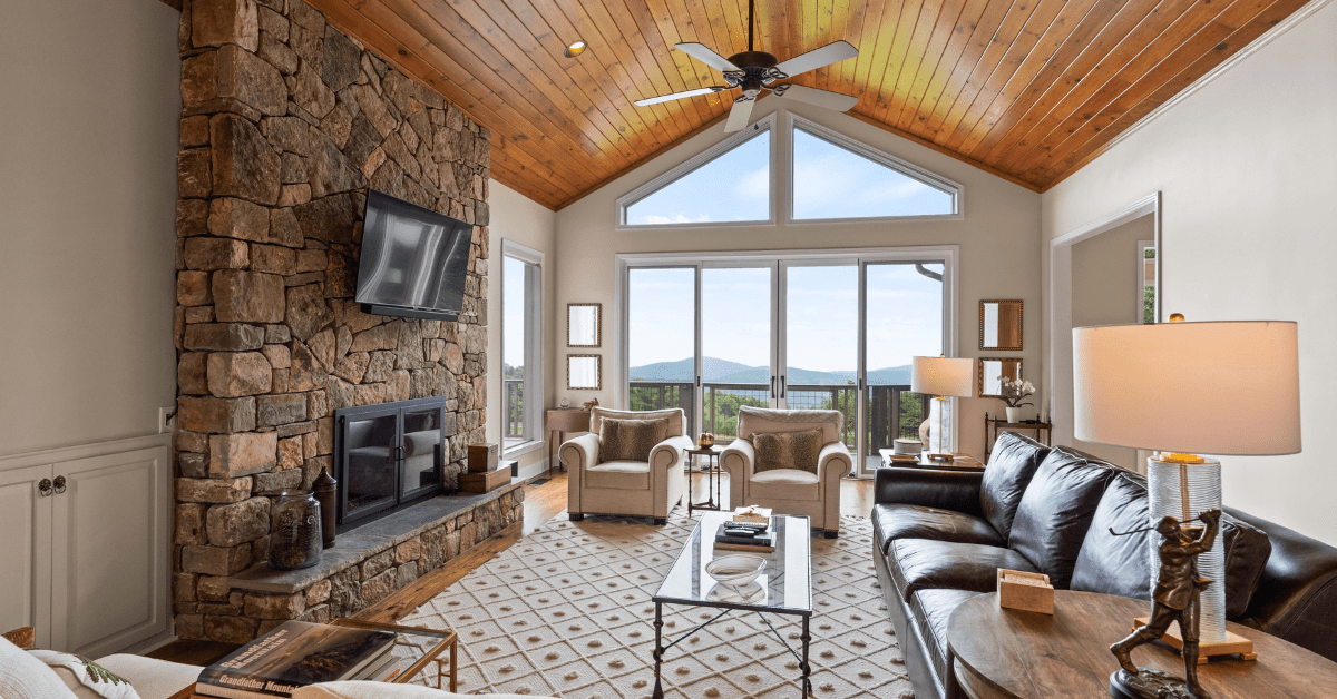 A modern living room with wood ceiling.