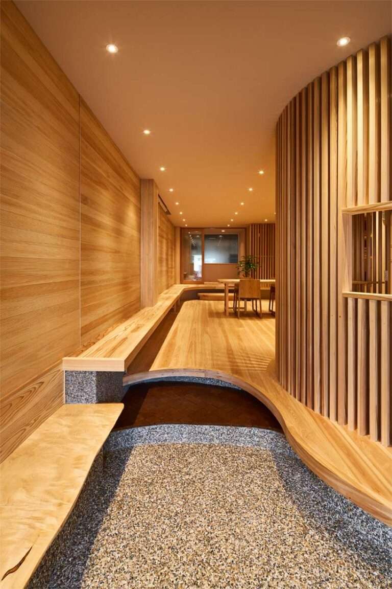 wooden louvers run along kyoto office space’s entire interior by ujizono architects