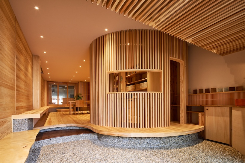wooden louvers run along kyoto office space's entire interior by ujizono architects