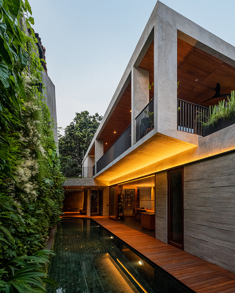 concrete breezeblocks clad residence's facade by wiyoga nurdiansyah architects