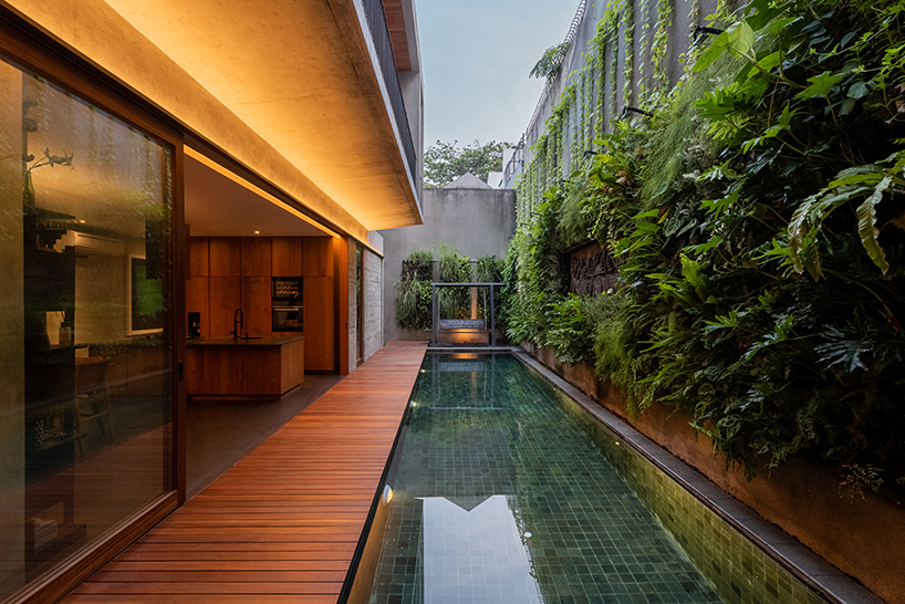 concrete breezeblocks clad residence's facade by wiyoga nurdiansyah architects