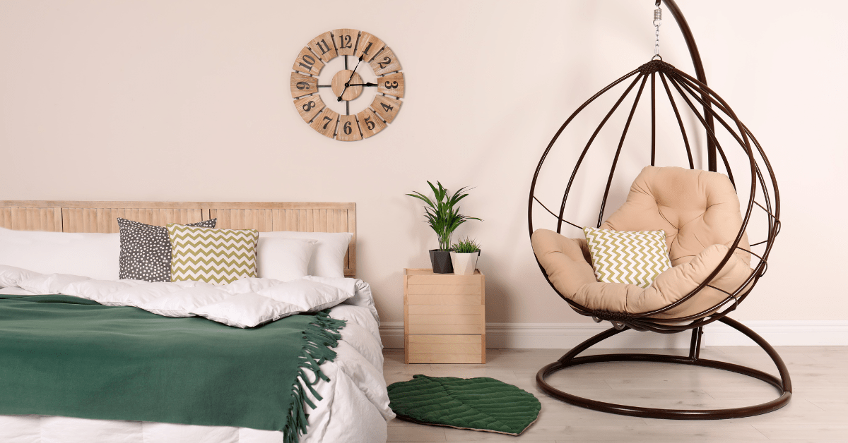 A hanging chair in a bedroom.