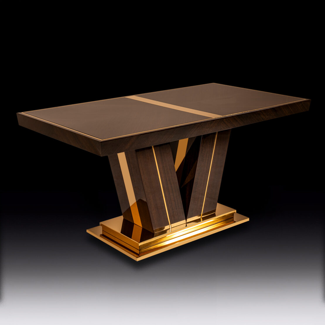 The Exclusive Abstract Rectangular Designer Dining Table boasts a sleek, modern design with a glossy dark wood surface highlighted by opulent gold accents. This exclusive piece stands on a unique angular pedestal base featuring geometric wooden and gold elements, creating an air of luxury against a plain dark background.