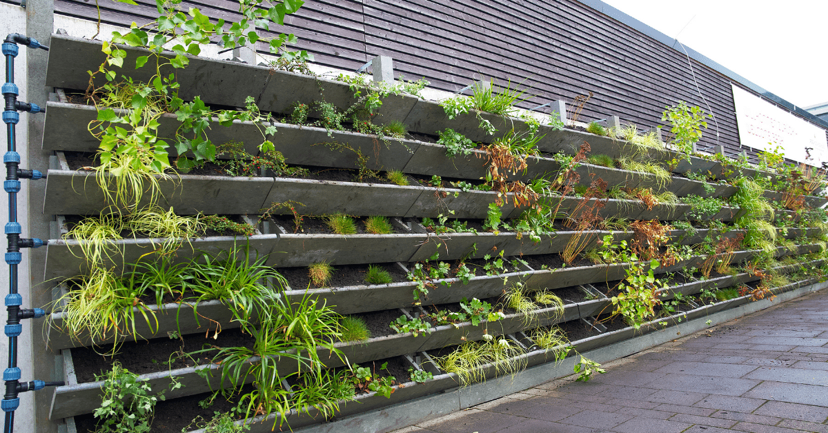 Fence with planters mounted all over it.