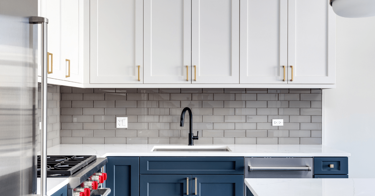 Blue cabinets with white counter.