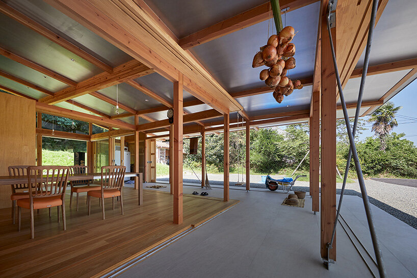 curved roof follows ridgeline of japanese mountains in weekend home by ota archistudio