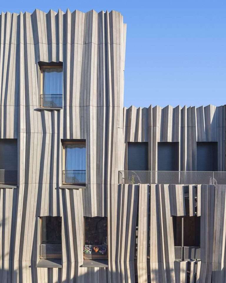 kengo kuma drapes parisian residential building 'yama-tani' in fluidly pleated timber