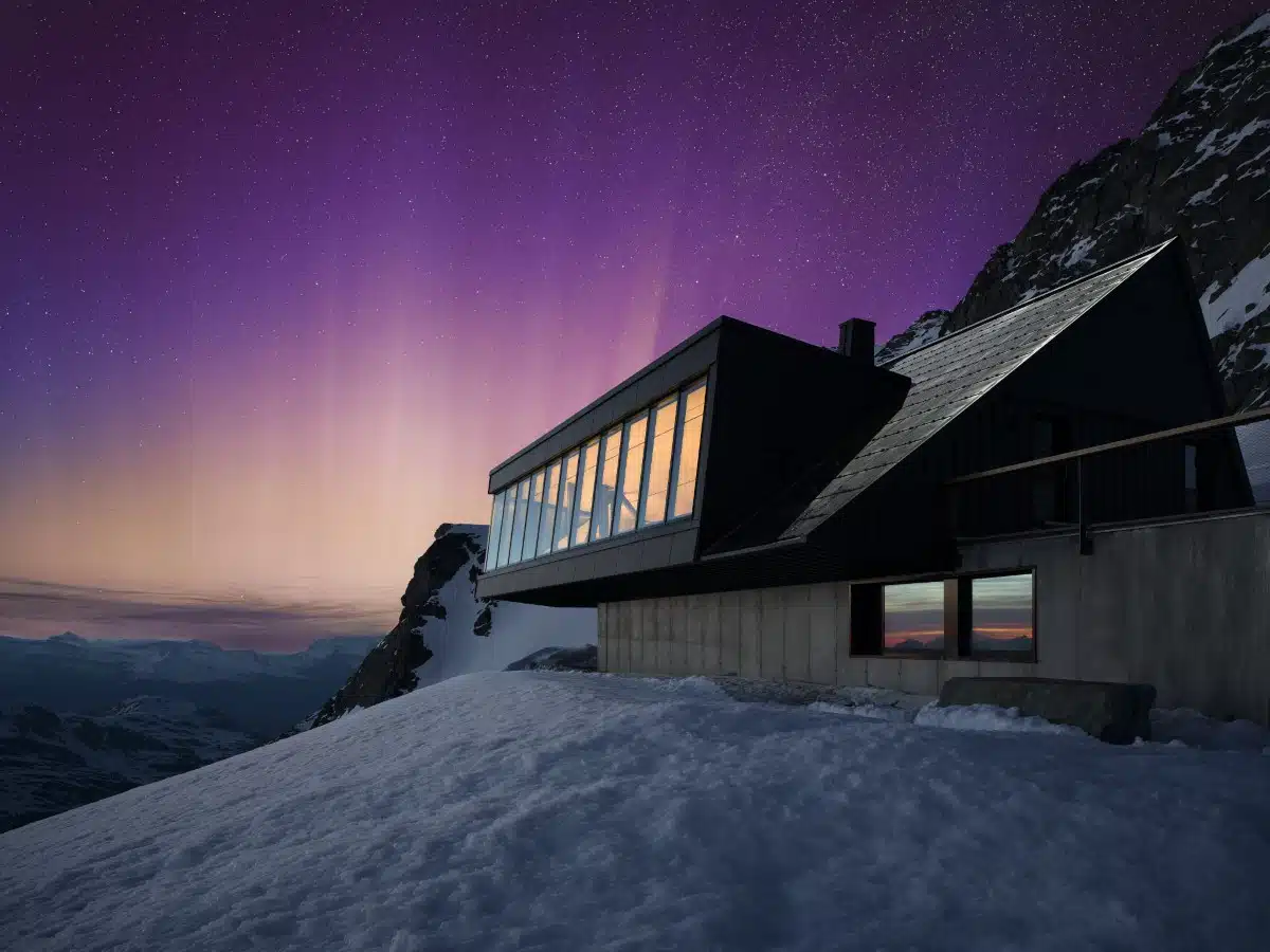 Pictures of Northern Lights surrounding hotel in Switzerland by Snorre Stinessen