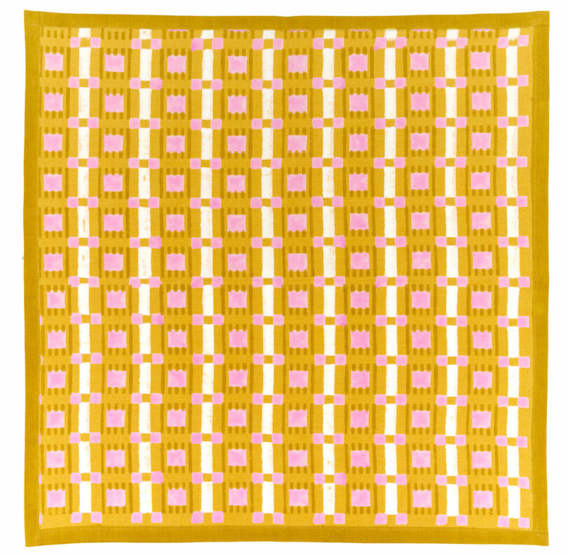 A geometric, grid-like pattern reminiscent of a chef's precision, with yellow, pink, and white squares arranged in a repeating design.