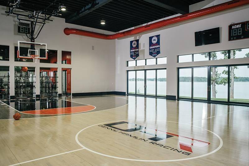 Basketball court inside of a mansion.