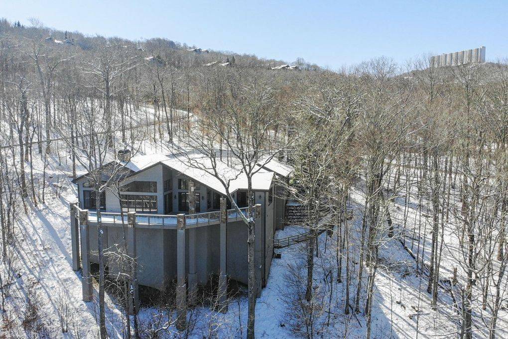 House on the side of a snowy hill.