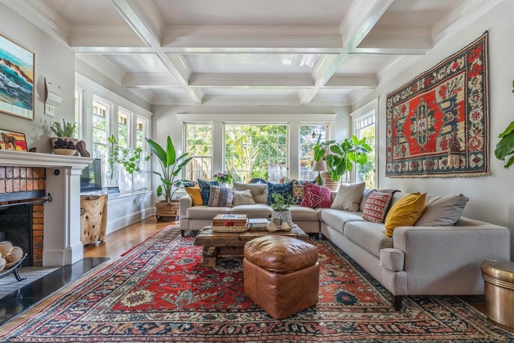 Transitional large living room with boho accents by DECORILLA