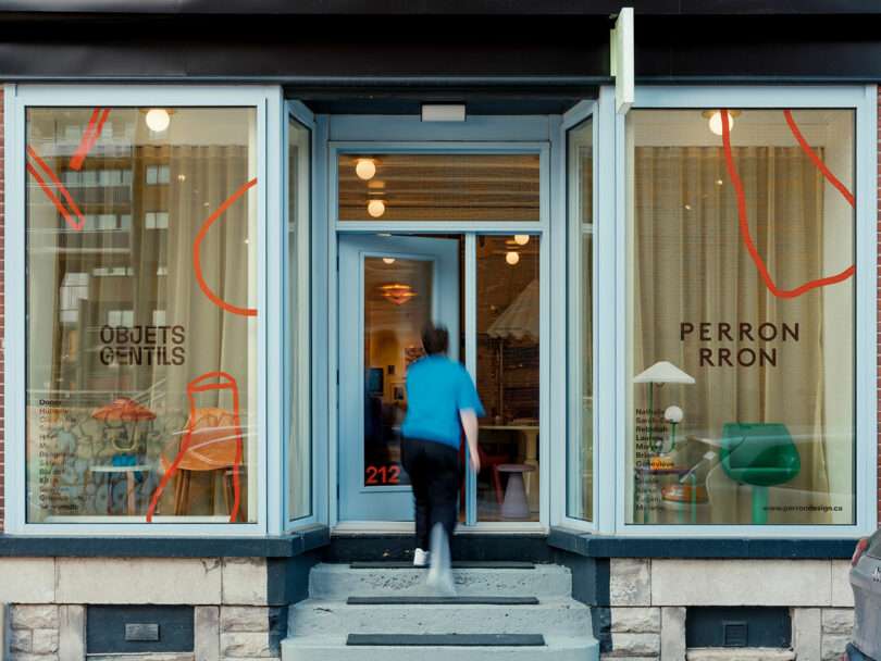 Person entering a glass-fronted store with signage reading "Objets Gentils" and "Perron Rron.