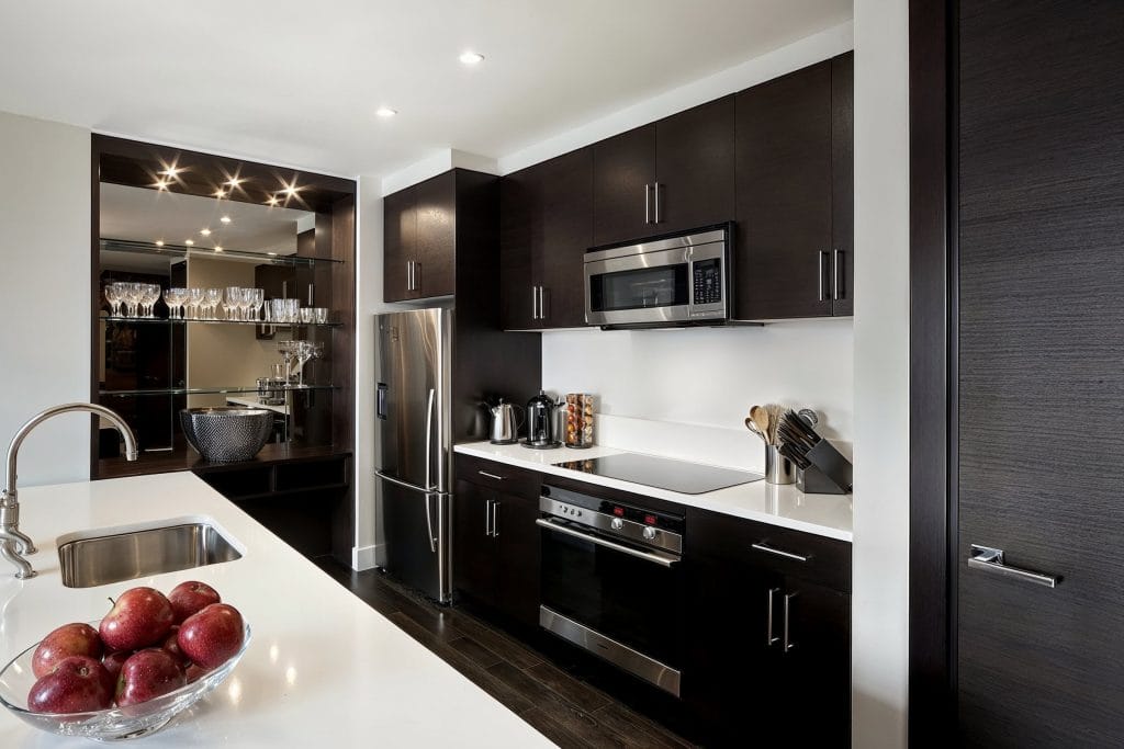 Glamorous modern kitchen open shelving decor by DECORILLA designer Joseph G. 