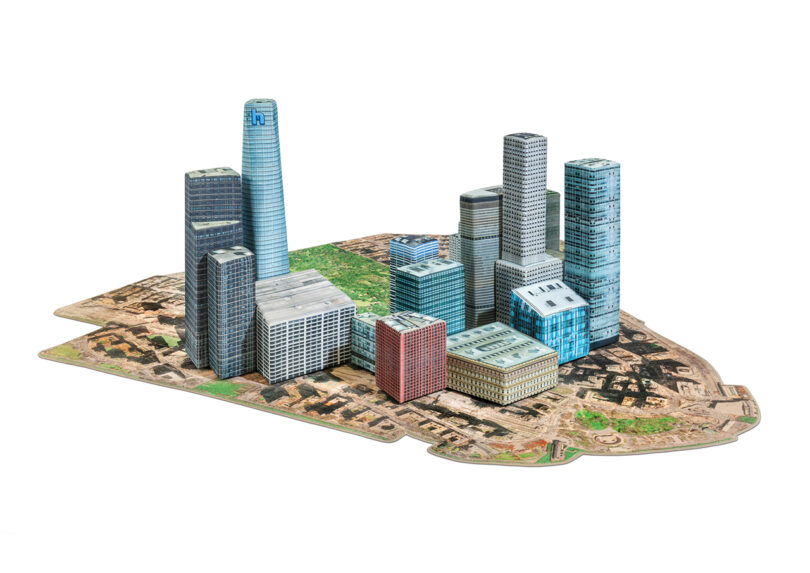 A 3D model of a cityscape featuring various modern skyscrapers and buildings on a green and brown base.