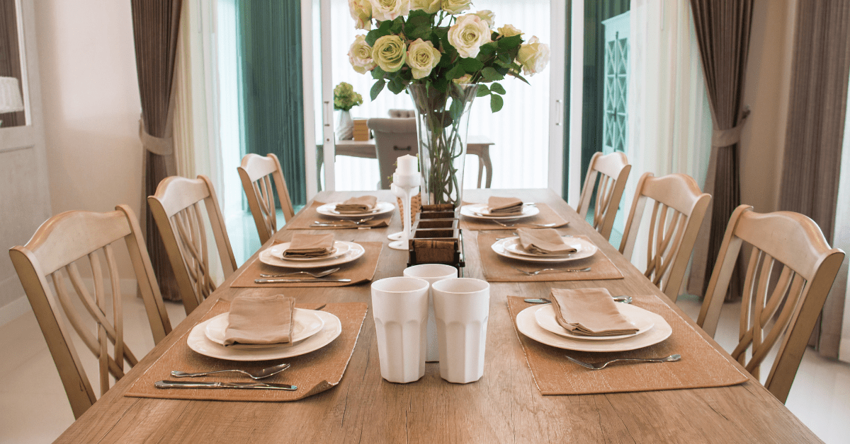 Dinning room table with dishware.