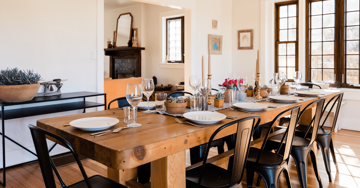 Dinning room table with dishware.