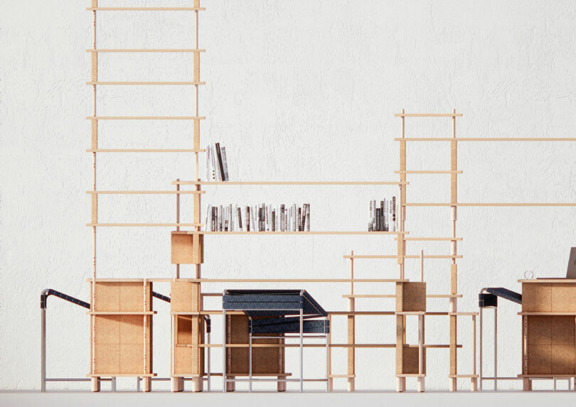 A minimalist wooden shelving unit against a white wall, with books and various objects placed on it