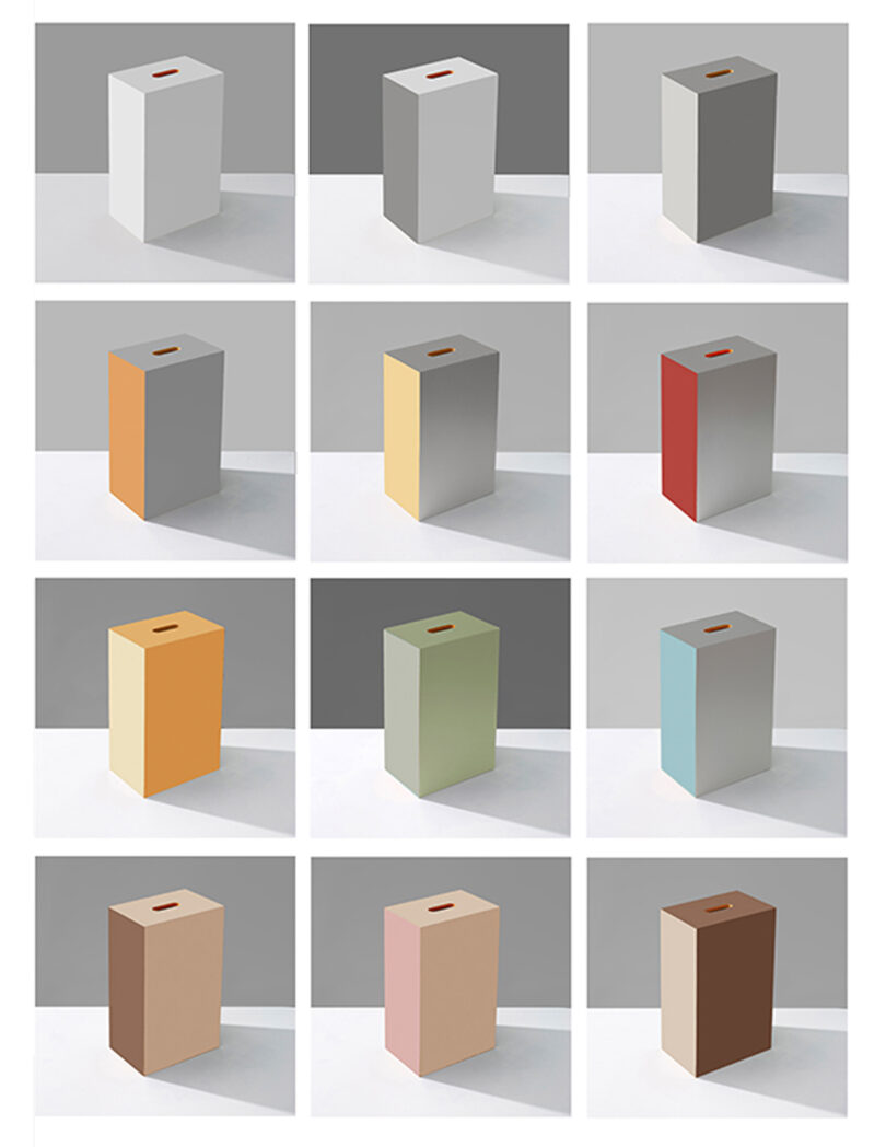 A grid of twelve 3D rectangular prisms in various colors, each with a square cutout on top