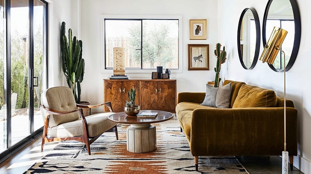 A sleek statement floor lamp in a mid-century living room by Decorilla