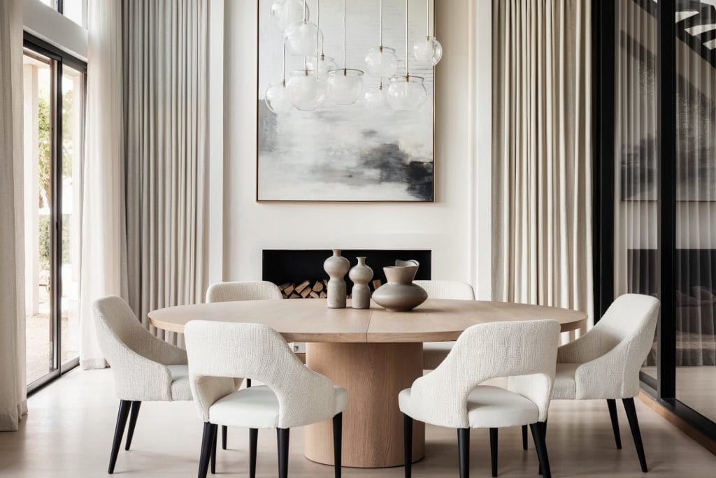 Statement pendant cluster enhances a dining room by Decorilla