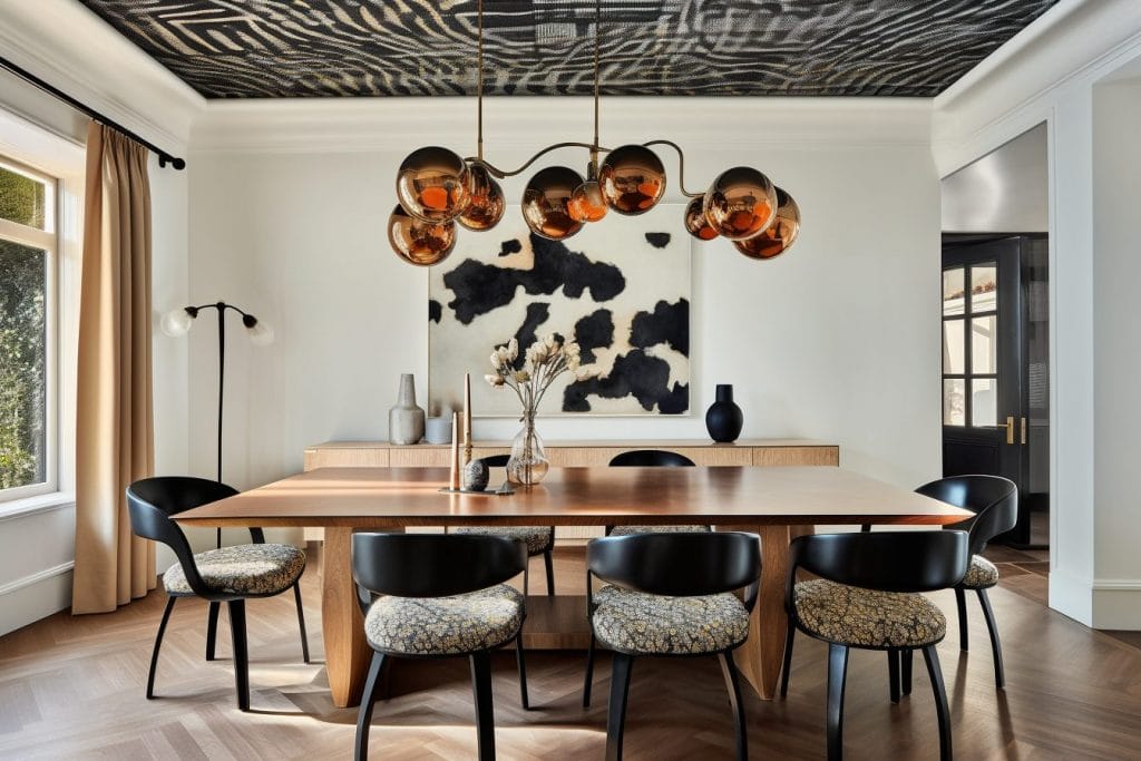 Sculptural statement pendant lights define a dining room by Decorilla