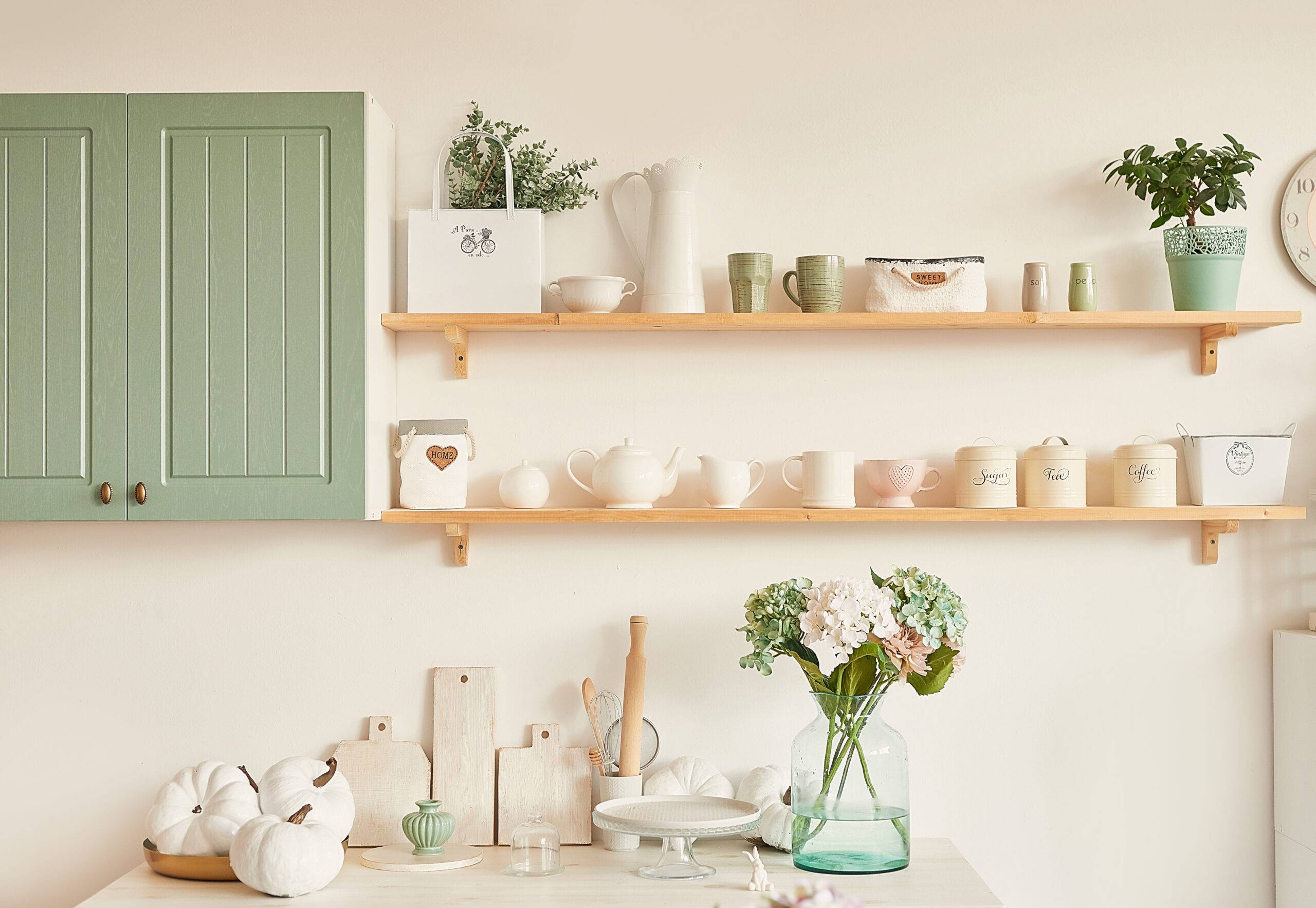 bright kitchen in the style of Provence, on the table dishes and a bouquet of flowers in a vase