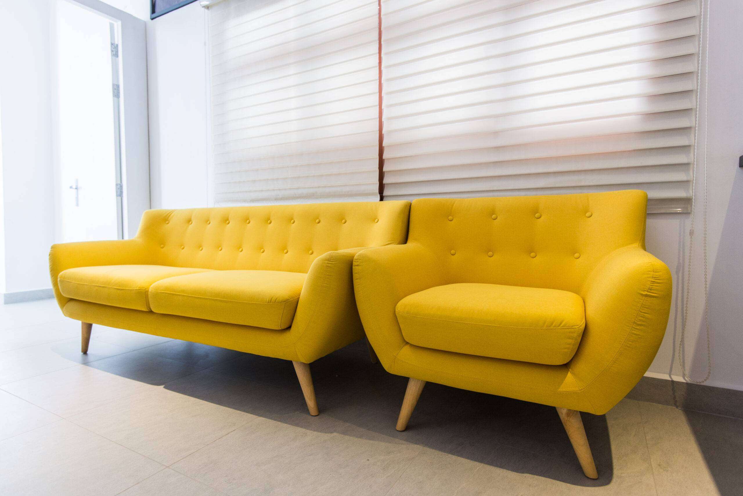 old sofa vintage yellow at home or hotel interior.