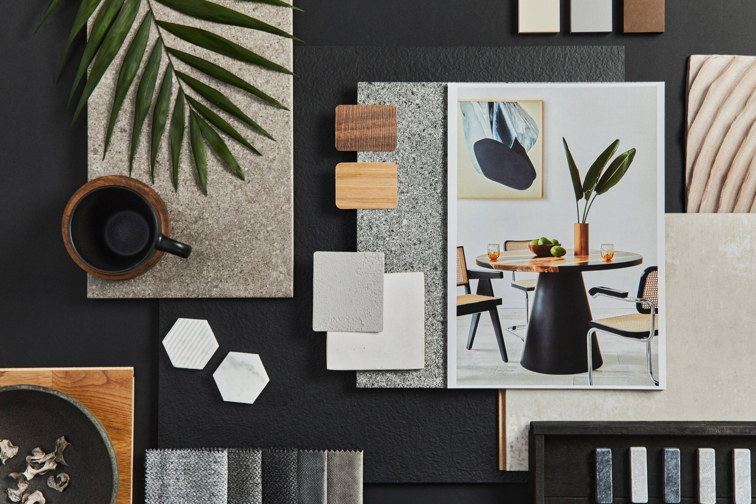 A physical interior design mood board laid out on a table.