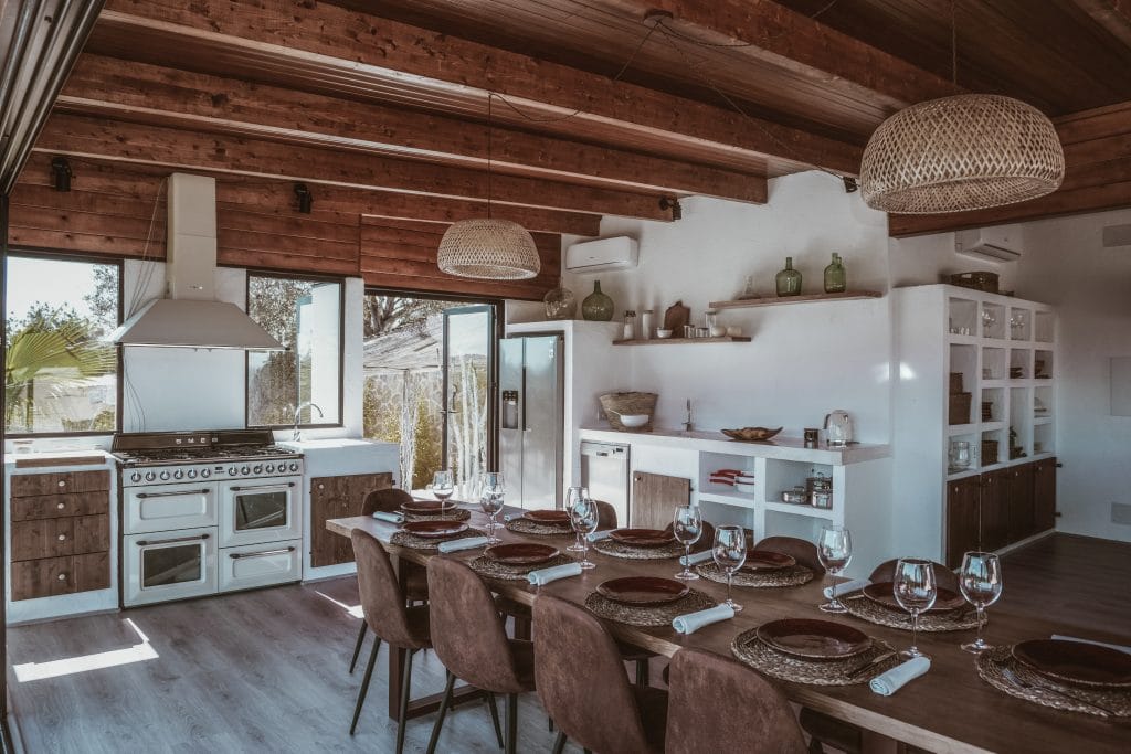 Rustic kitchen with vintage style stove by DECORILLA designer, Jasmine