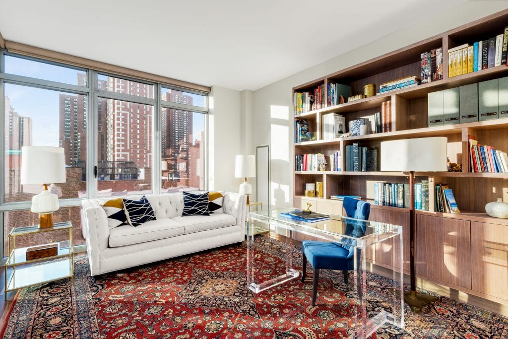 Bookshelf wealth in a home office by Decorilla designer, Joyce T. 