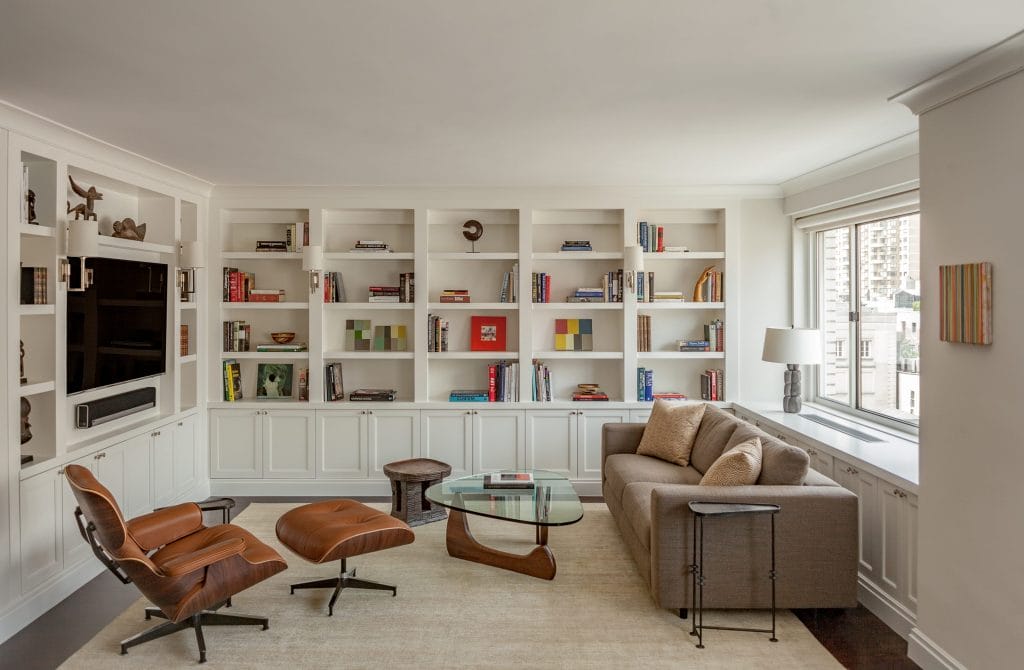Bookshelf wealth in a family room by Decorilla designer, Leonora M.