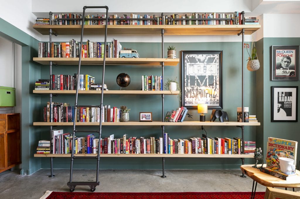 Eclectic interior by Decorilla showcasing bookshelf wealth by Decorilla desginer, Francis D.