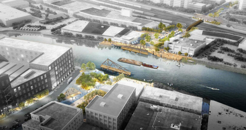 Aerial view of an urban waterfront development designed by JUN AIZAKI, featuring pedestrian bridges, green spaces, boats on the river, and industrial buildings surrounding the area.