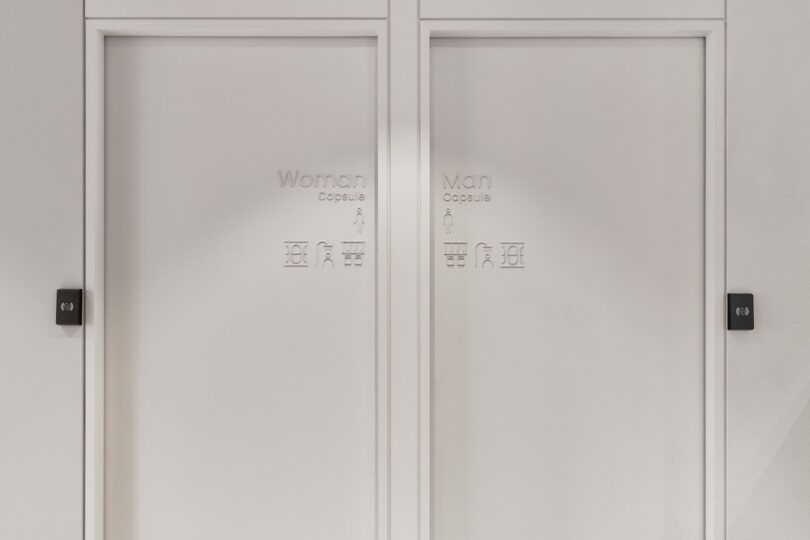 Two adjacent white doors labeled