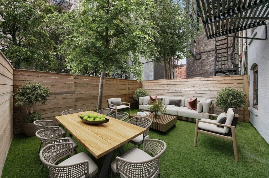 Best patio dining furniture in a city yard by Decorilla designer, Leanna S. 