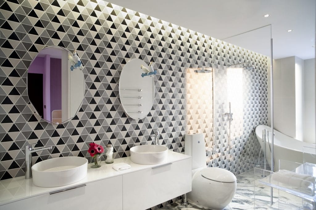 Ultra modern primary bathroom tile ideas by DECORILLA designer, Sergio M. 