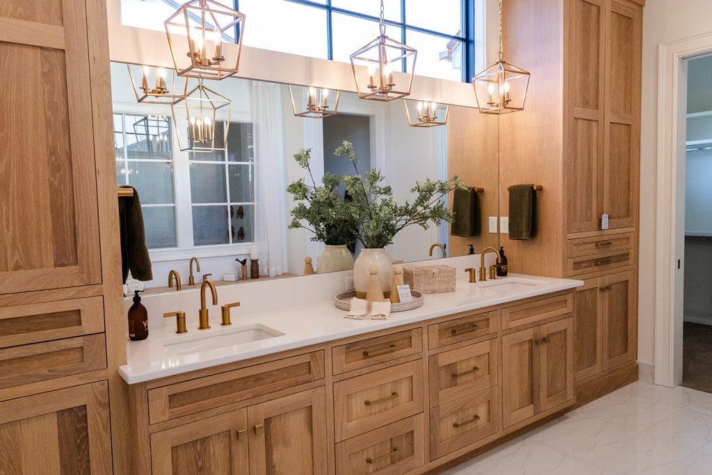 Transitional primary bathroom ideas with gold accents by DECORILLA designer, Sharene M. 