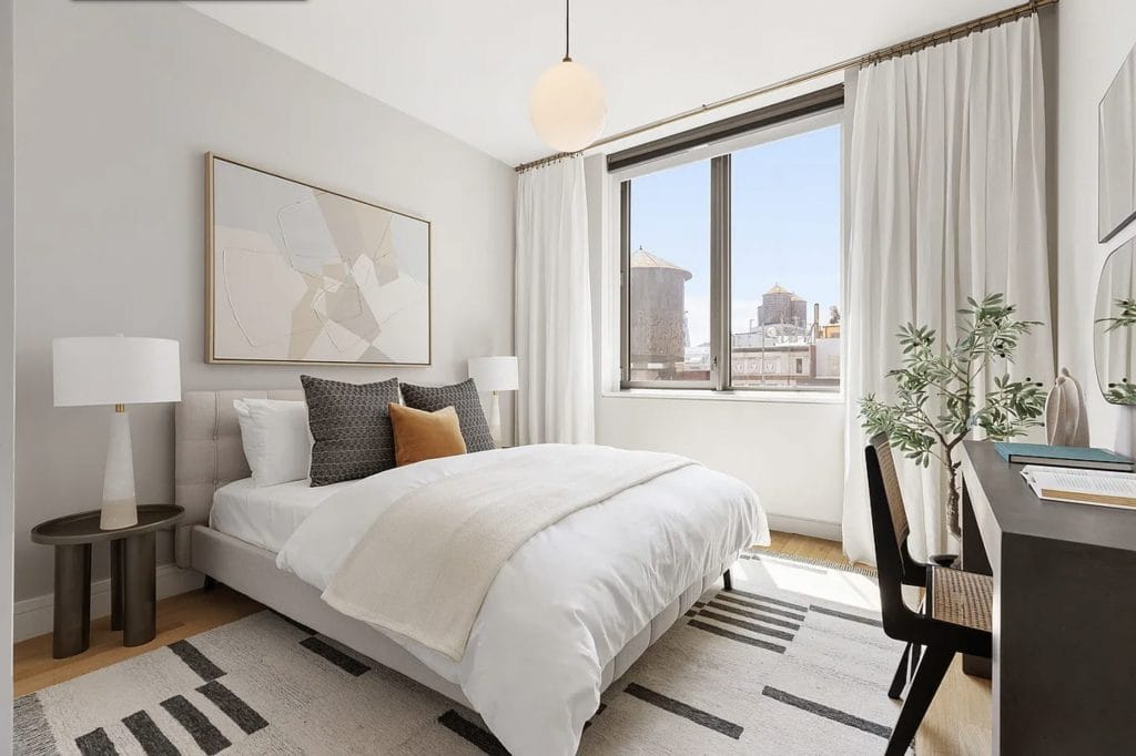 Light gray bedroom by Decorilla designer, Leanna S.—paint colors that increase home value
