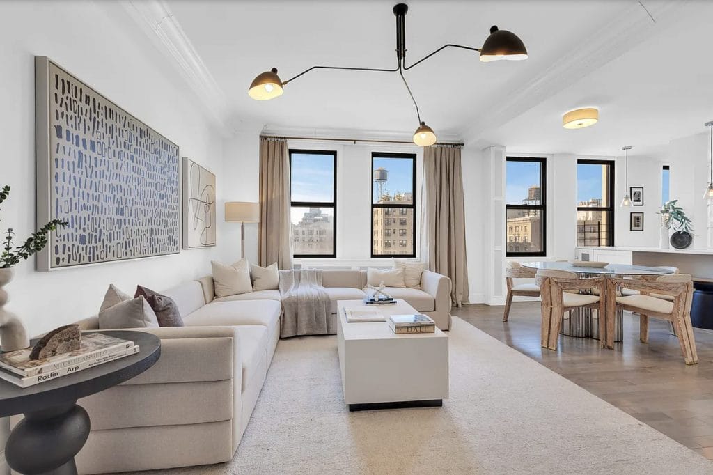 Crisp white living room by Decorilla designer, Leanna S.—paint colors that increase home value