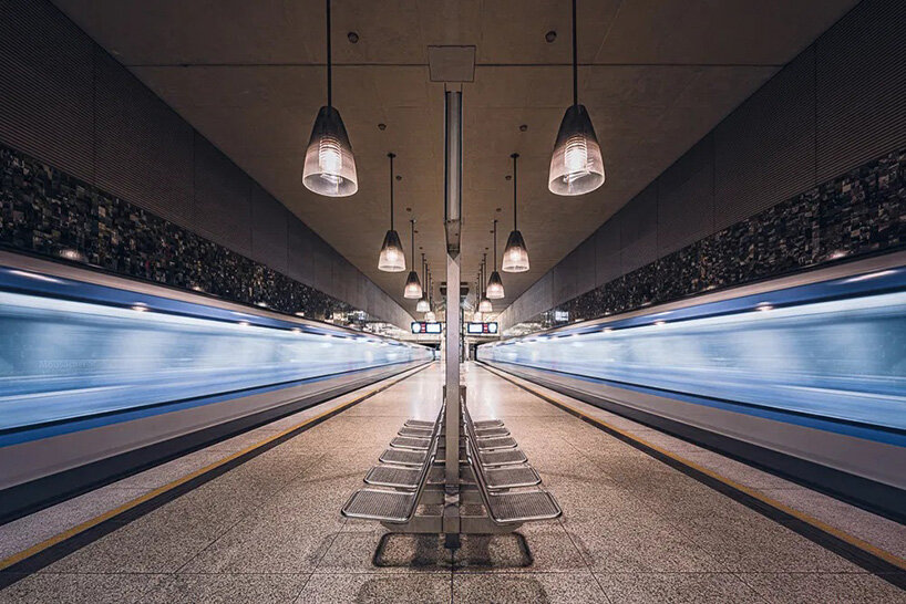 european metro stations unfold as mirrored worlds of calm in thibault drutel's photo series